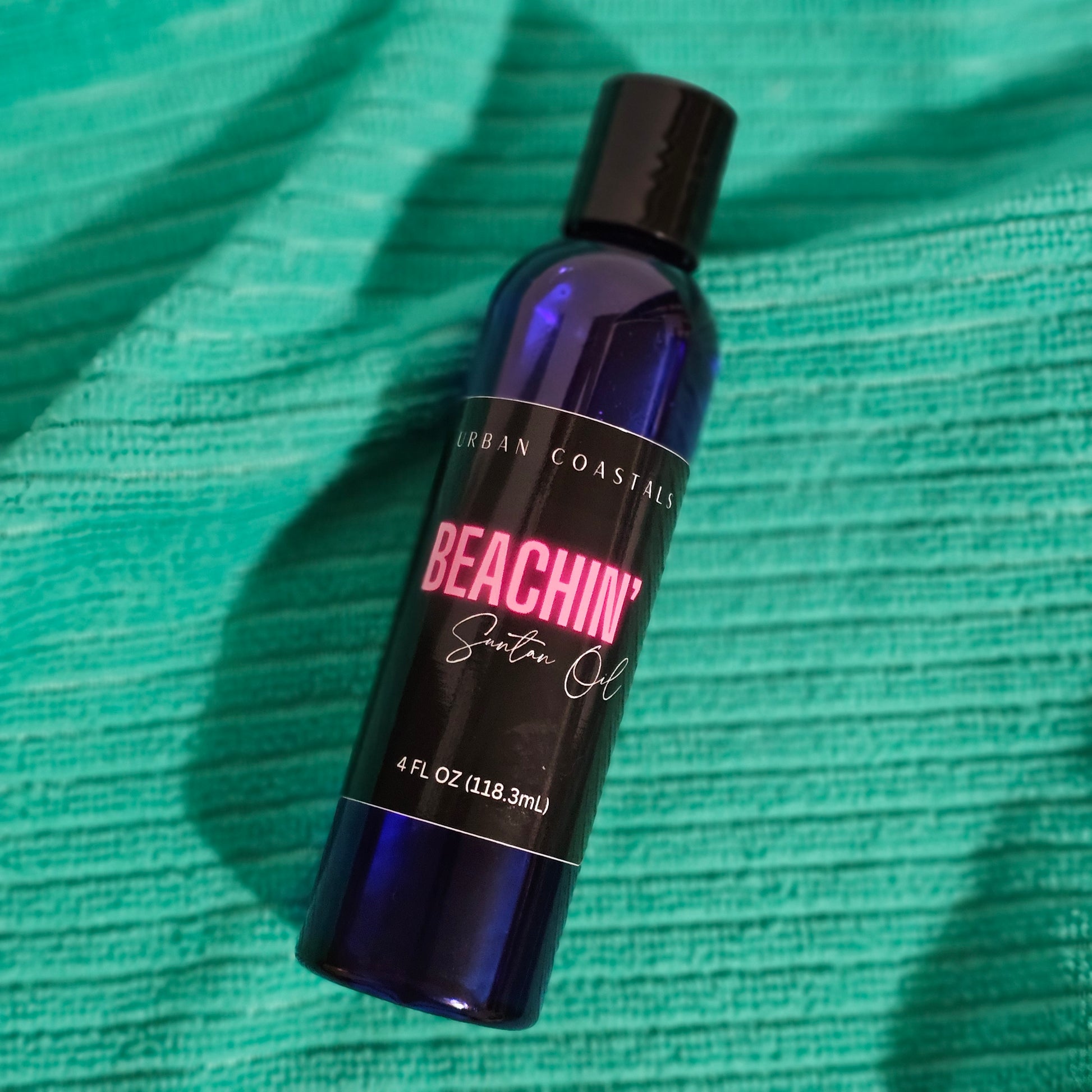 4oz blue bottle with suntan oil made from baby oil and glycerin