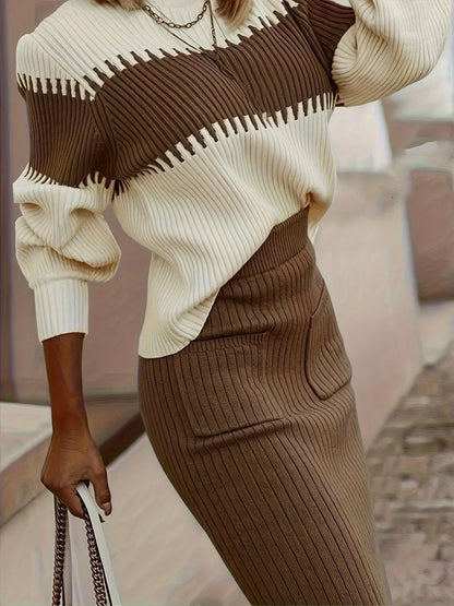 Person wearing a brown and beige sweater with a blurred background
