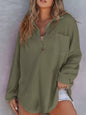 Woman wearing a green textured shirt against a gray background