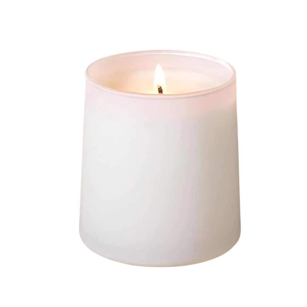 White candle with a lit wick on a white background