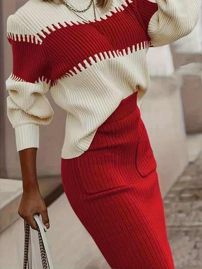 Person wearing a red and white sweater with a red skirt, holding a white handbag.