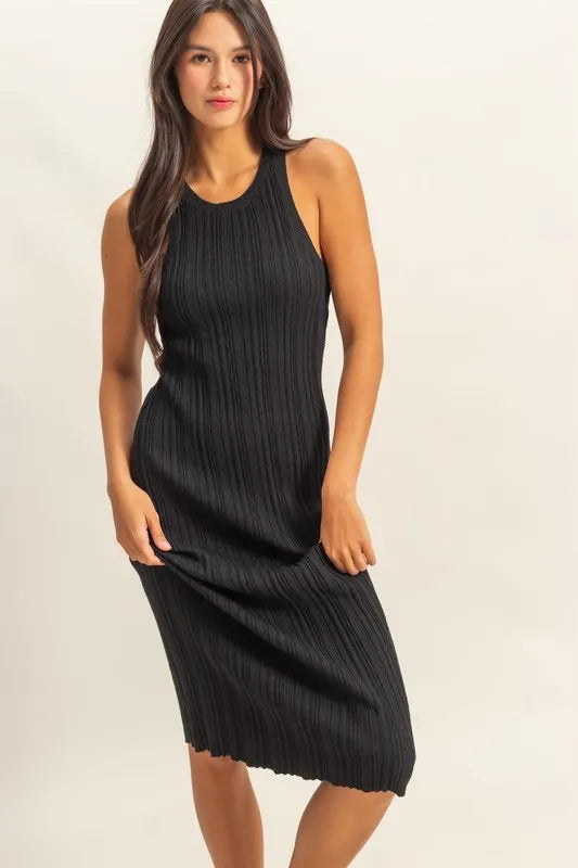 The round neck offers a classic and flattering neckline. The black color bodycon silhouette hugs your figure in all the right places for a sexy and confident look. The ribbed knit fabric adds texture and dimension to the dress.