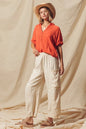 Made from a blend of cotton and linen, these natural color pants offer a breathable and textured fabric that is perfect for casual wear. The slouchy fit and wide legs provide a relaxed and trendy look.