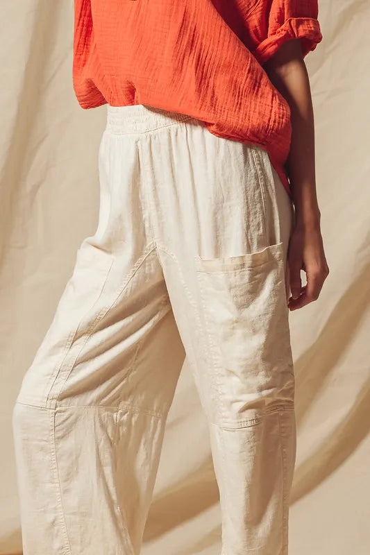 Made from a blend of cotton and linen, these natural color pants offer a breathable and textured fabric that is perfect for casual wear. The slouchy fit and wide legs provide a relaxed and trendy look.