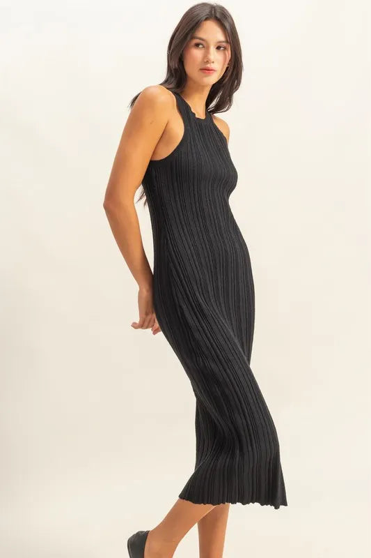 The round neck offers a classic and flattering neckline. The black color bodycon silhouette hugs your figure in all the right places for a sexy and confident look. The ribbed knit fabric adds texture and dimension to the dress.