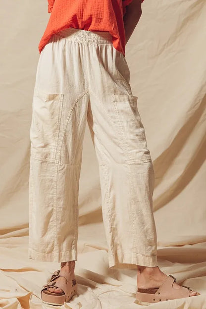 Made from a blend of cotton and linen, these natural color pants offer a breathable and textured fabric that is perfect for casual wear. The slouchy fit and wide legs provide a relaxed and trendy look.