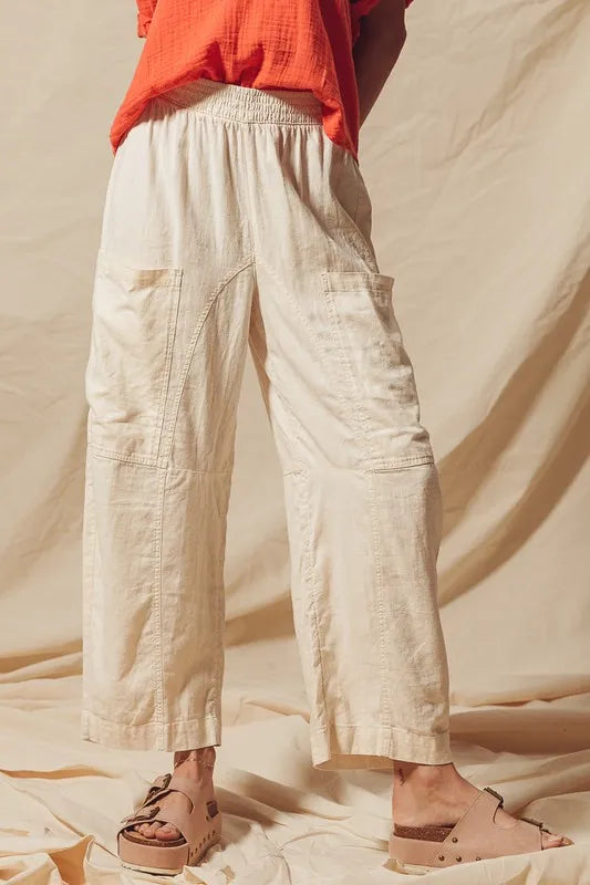 Made from a blend of cotton and linen, these natural color pants offer a breathable and textured fabric that is perfect for casual wear. The slouchy fit and wide legs provide a relaxed and trendy look.