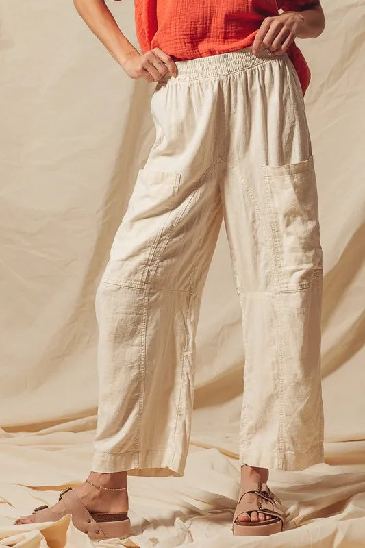 Made from a blend of cotton and linen, these natural color pants offer a breathable and textured fabric that is perfect for casual wear. The slouchy fit and wide legs provide a relaxed and trendy look.