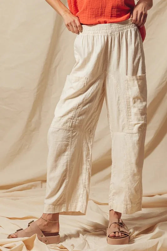 Made from a blend of cotton and linen, these natural color pants offer a breathable and textured fabric that is perfect for casual wear. The slouchy fit and wide legs provide a relaxed and trendy look.