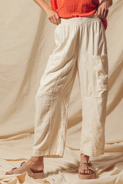 Made from a blend of cotton and linen, these natural color pants offer a breathable and textured fabric that is perfect for casual wear. The slouchy fit and wide legs provide a relaxed and trendy look.