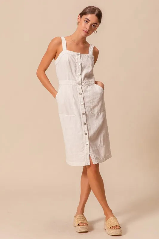 The Button Down Pocket Front Pinafore Dress is a stylish and versatile piece for your wardrobe. With a button-down front and pocket detailing, this pinafore dress offers a classic and chic look.