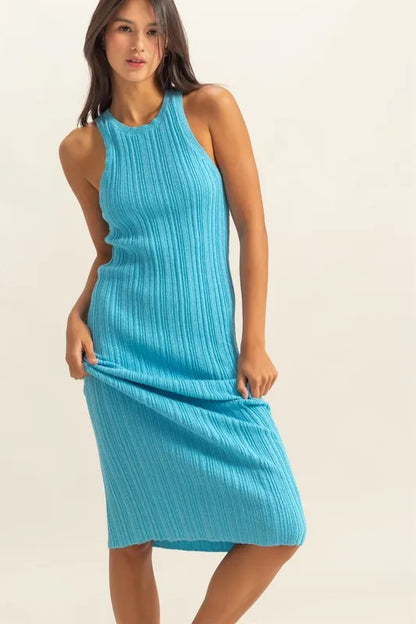 The round neck offers a classic and flattering neckline. The bodycon silhouette hugs your figure in all the right places for a sexy and confident look. The ribbed knit aquamarine color fabric adds texture and dimension.