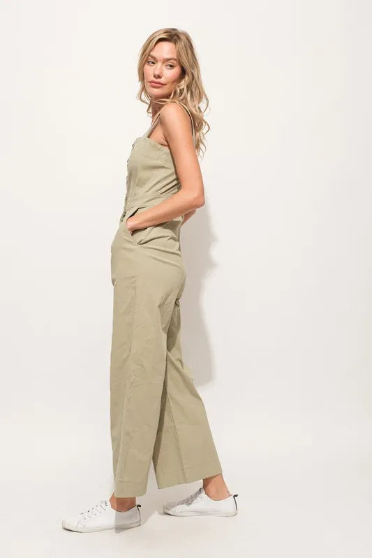 The Square Neck Button Down Cropped Wide-leg Sage Jumpsuit is a stylish and versatile one-piece outfit with a square neckline, button-down front, and wide-leg cropped pants.