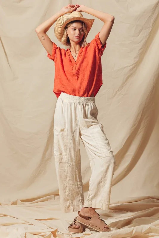 Made from a blend of cotton and linen, these natural color pants offer a breathable and textured fabric that is perfect for casual wear. The slouchy fit and wide legs provide a relaxed and trendy look.
