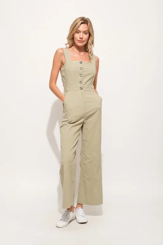 The Square Neck Button Down Cropped Wide-leg Sage Jumpsuit is a stylish and versatile one-piece outfit with a square neckline, button-down front, and wide-leg cropped pants.