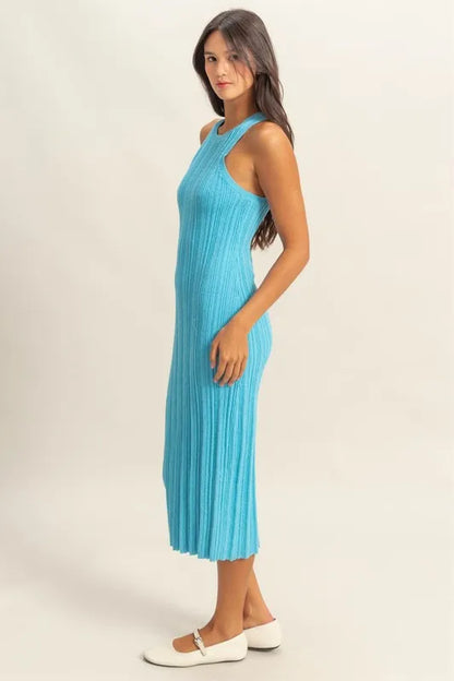 The round neck offers a classic and flattering neckline. The bodycon silhouette hugs your figure in all the right places for a sexy and confident look. The ribbed knit aquamarine color fabric adds texture and dimension.
