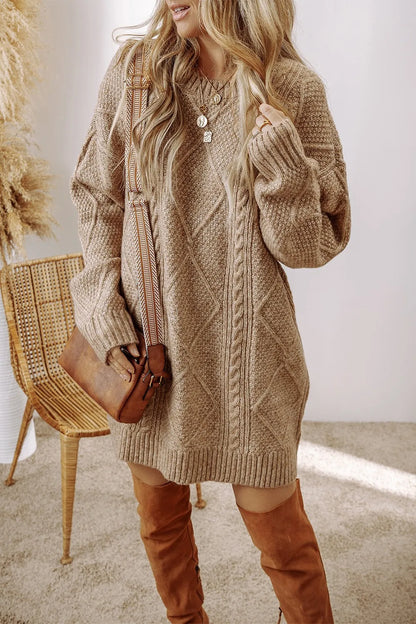 Woman wearing a beige knitted dress with brown over-the-knee boots indoors.