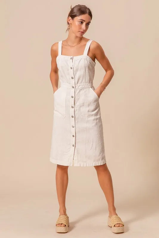 The Button Down Pocket Front Pinafore Dress is a stylish and versatile piece for your wardrobe. With a button-down front and pocket detailing, this pinafore dress offers a classic and chic look.