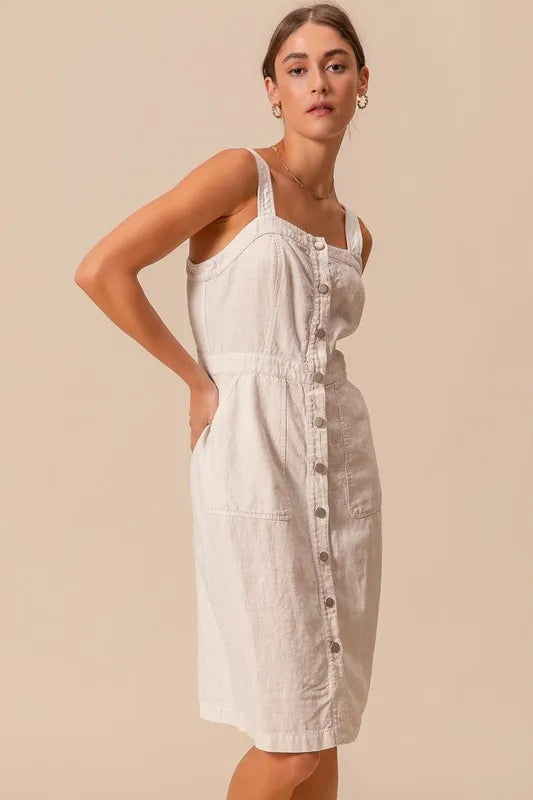 The Button Down Pocket Front Pinafore Dress is a stylish and versatile piece for your wardrobe. With a button-down front and pocket detailing, this pinafore dress offers a classic and chic look.