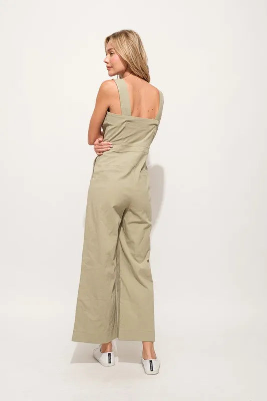 The Square Neck Button Down Cropped Wide-leg Sage Jumpsuit is a stylish and versatile one-piece outfit with a square neckline, button-down front, and wide-leg cropped pants.