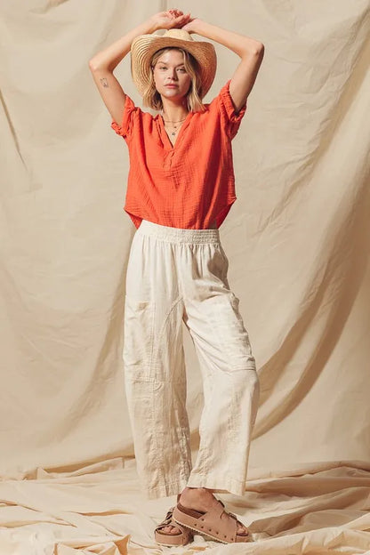 Made from a blend of cotton and linen, these natural color pants offer a breathable and textured fabric that is perfect for casual wear. The slouchy fit and wide legs provide a relaxed and trendy look.